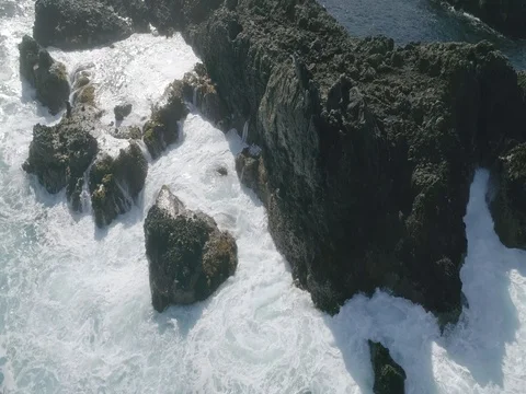 4k Slowmotion drone shot of powerful ocean waves crashing rocks in Tenerife Stock Footage 84190941