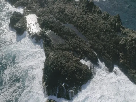 4k Slowmotion drone shot of powerful ocean waves crashing rocks in Tenerife Stock Footage 84191012