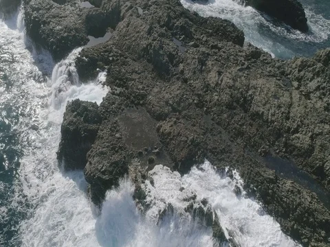 4k Slowmotion drone shot of powerful ocean waves crashing rocks in Tenerife Stock Footage 84191020