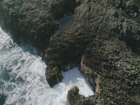 4k Slowmotion drone shot of powerful ocean waves crashing rocks in Tenerife Stock Footage 84191026