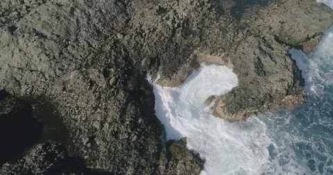 4k Slowmotion drone shot of powerful ocean waves crashing rocks in Tenerife Stock Footage 84191030