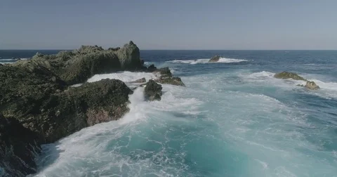 4k Slowmotion drone shot of powerful ocean waves crashing rocks in Tenerife Stock Footage 84191046