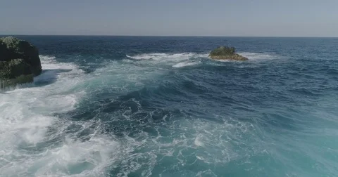 4k Slowmotion drone shot of powerful ocean waves crashing rocks in Tenerife Stock Footage 84191191