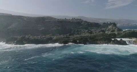 4k Slowmotion drone shot of powerful ocean waves crashing rocks in Tenerife Stock Footage 84191655