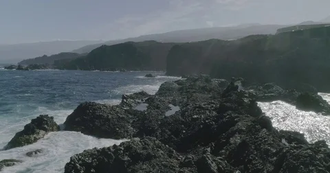 4k Slowmotion drone shot of powerful ocean waves crashing rocks in Tenerife Stock Footage 84192288