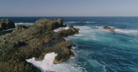 4k Slowmotion drone shot of powerful ocean waves crashing rocks in Tenerife Stock Footage 84192427
