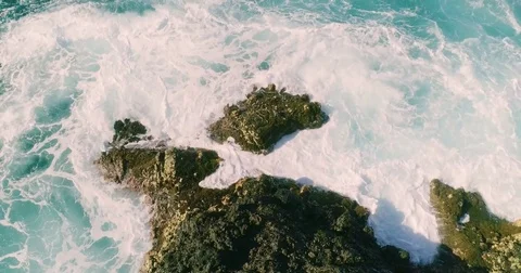 4k Slowmotion drone shot of powerful ocean waves crashing rocks in Tenerife Stock Footage 84192555