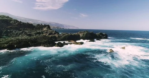 4k Slowmotion drone shot of powerful ocean waves crashing rocks in Tenerife Stock Footage 84192740