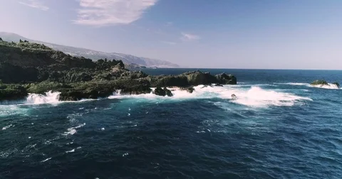 4k Slowmotion drone shot of powerful ocean waves crashing rocks in Tenerife Stock Footage 84192782