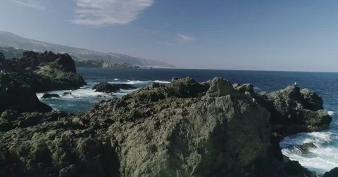 4k Slowmotion drone shot of powerful ocean waves crashing rocks in Tenerife Stock Footage 84192848
