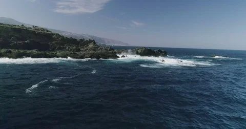 4k Slowmotion drone shot of powerful ocean waves crashing rocks in Tenerife Stock Footage 84192881
