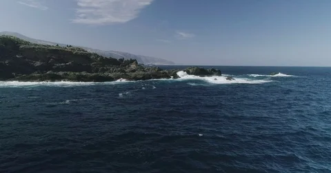 4k Slowmotion drone shot of powerful ocean waves crashing rocks in Tenerife Stock Footage 84192979