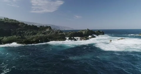 4k Slowmotion drone shot of powerful ocean waves crashing rocks in Tenerife Stock Footage 84192981