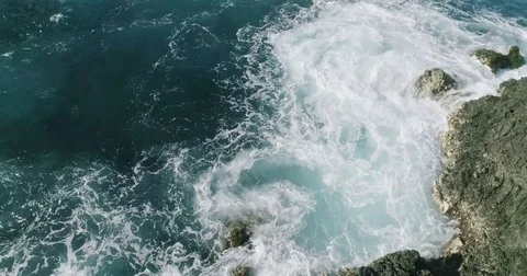 4k Slowmotion drone shot of powerful ocean waves crashing rocks in Tenerife Stock Footage 84193253