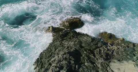 4k Slowmotion drone shot of powerful ocean waves crashing rocks in Tenerife Stock Footage 84193282