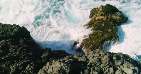 4k Slowmotion drone shot of powerful ocean waves crashing rocks in Tenerife Stock Footage 84193323