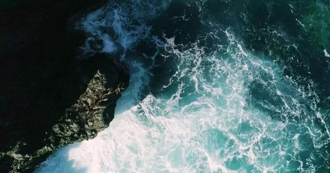 4k Slowmotion drone shot of powerful ocean waves crashing rocks in Tenerife Stock Footage 84193393
