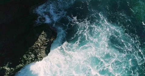 4k Slowmotion drone shot of powerful ocean waves crashing rocks in Tenerife Stock Footage 84193441