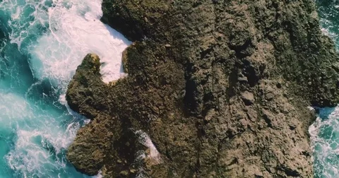 4k Slowmotion drone shot of powerful ocean waves crashing rocks in Tenerife Stock Footage 84193556