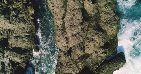 4k Slowmotion drone shot of powerful ocean waves crashing rocks in Tenerife Stock Footage 84193713
