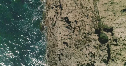 4k Slowmotion drone shot of powerful ocean waves crashing rocks in Tenerife Stock Footage 84194118