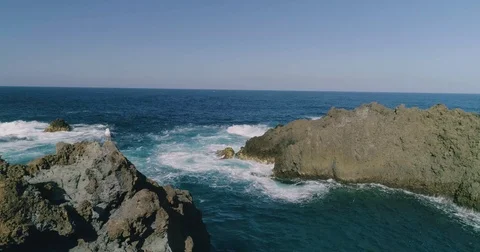 4k Slowmotion drone shot of powerful ocean waves crashing rocks in Tenerife Stock Footage 84194125