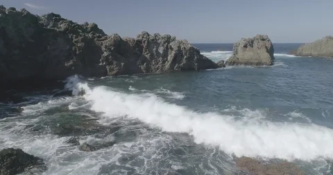 4k Slowmotion drone shot of powerful ocean waves crashing rocks in Tenerife Stock Footage 84194168