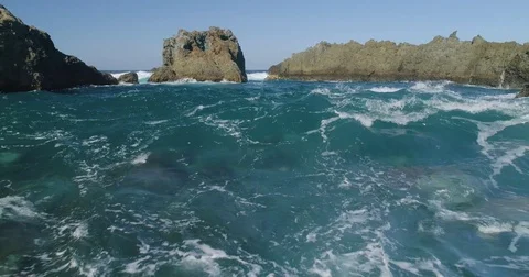 4k Slowmotion drone shot of powerful ocean waves crashing rocks in Tenerife Stock Footage 84194192