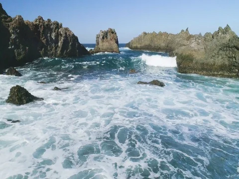 4k Slowmotion drone shot of powerful ocean waves crashing rocks in Tenerife Stock Footage 84194231