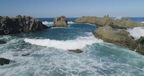 4k Slowmotion drone shot of powerful ocean waves crashing rocks in Tenerife Stock Footage 84194325