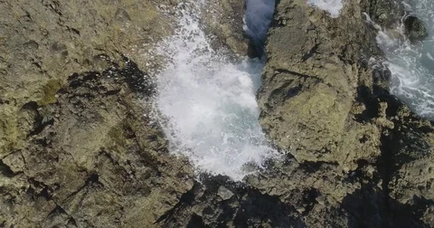 4k Slowmotion drone shot of powerful ocean waves crashing rocks in Tenerife Stock Footage 84194470