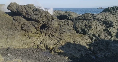 4k Slowmotion drone shot of powerful ocean waves crashing rocks in Tenerife Stock Footage 84194475