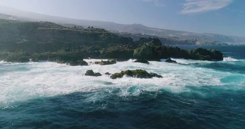 4k Slowmotion drone shot of powerful ocean waves crashing rocks in Tenerife Stock Footage 84194535