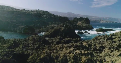 4k Slowmotion drone shot of powerful ocean waves crashing rocks in Tenerife Stock Footage 84194807