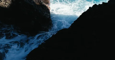 4k Slowmotion drone shot of powerful ocean waves crashing rocks in Tenerife Stock Footage 90272273