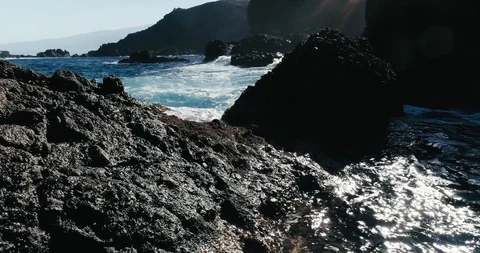 4k Slowmotion drone shot of powerful ocean waves crashing rocks in Tenerife Stock Footage 90272274