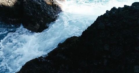 4k Slowmotion drone shot of powerful ocean waves crashing rocks in Tenerife Stock Footage 90272378