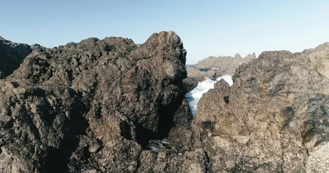 4k Slowmotion drone shot of powerful ocean waves crashing rocks in Tenerife Stock Footage 90272461
