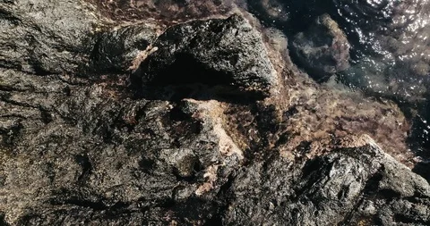 4k Slowmotion drone shot of powerful ocean waves crashing rocks in Tenerife Stock Footage 90272464
