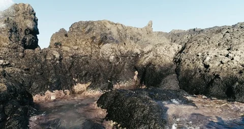 4k Slowmotion drone shot of powerful ocean waves crashing rocks in Tenerife Stock Footage 90272486