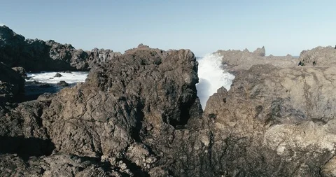 4k Slowmotion drone shot of powerful ocean waves crashing rocks in Canary Island Stock Footage 90272492