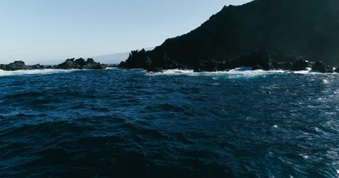 4k Slowmotion drone shot of powerful ocean waves crashing rocks in Tenerife Stock Footage 90272545