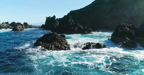 4k Slowmotion drone shot of powerful ocean waves crashing rocks in Tenerife Stock Footage 90272619