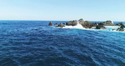 4k Slowmotion drone shot of powerful ocean waves crashing rocks in Tenerife Stock Footage 90272647