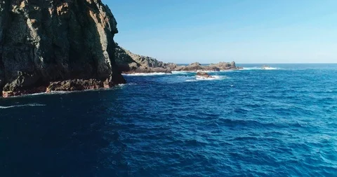4k Slowmotion drone shot of powerful ocean waves crashing rocks in Tenerife Stock Footage 90272753