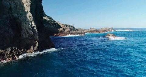 4k Slowmotion drone shot of powerful ocean waves crashing rocks in Tenerife Stock Footage 90272754