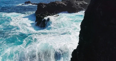4k Slowmotion drone shot of powerful ocean waves crashing rocks in Tenerife Stock Footage 90272862