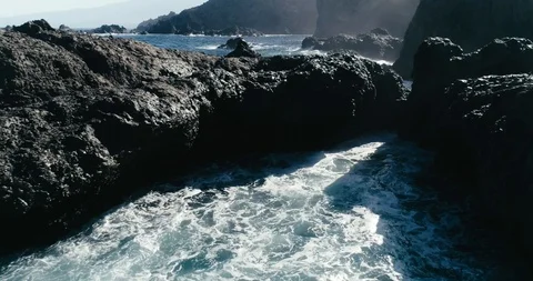 4k Slowmotion drone shot of powerful ocean waves crashing rocks in Tenerife Stock Footage 90272959