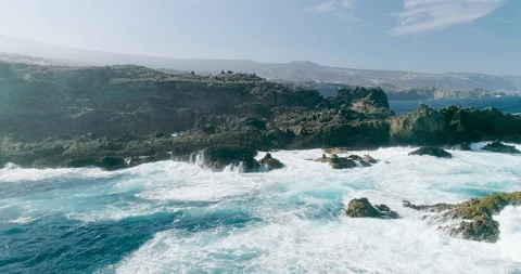 4k Slowmotion drone shot of powerful ocean waves crashing rocks in Tenerife Stock Footage 90283100