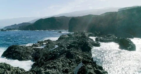 4k Slowmotion drone shot of powerful ocean waves crashing rocks in Tenerife Stock Footage 90284090